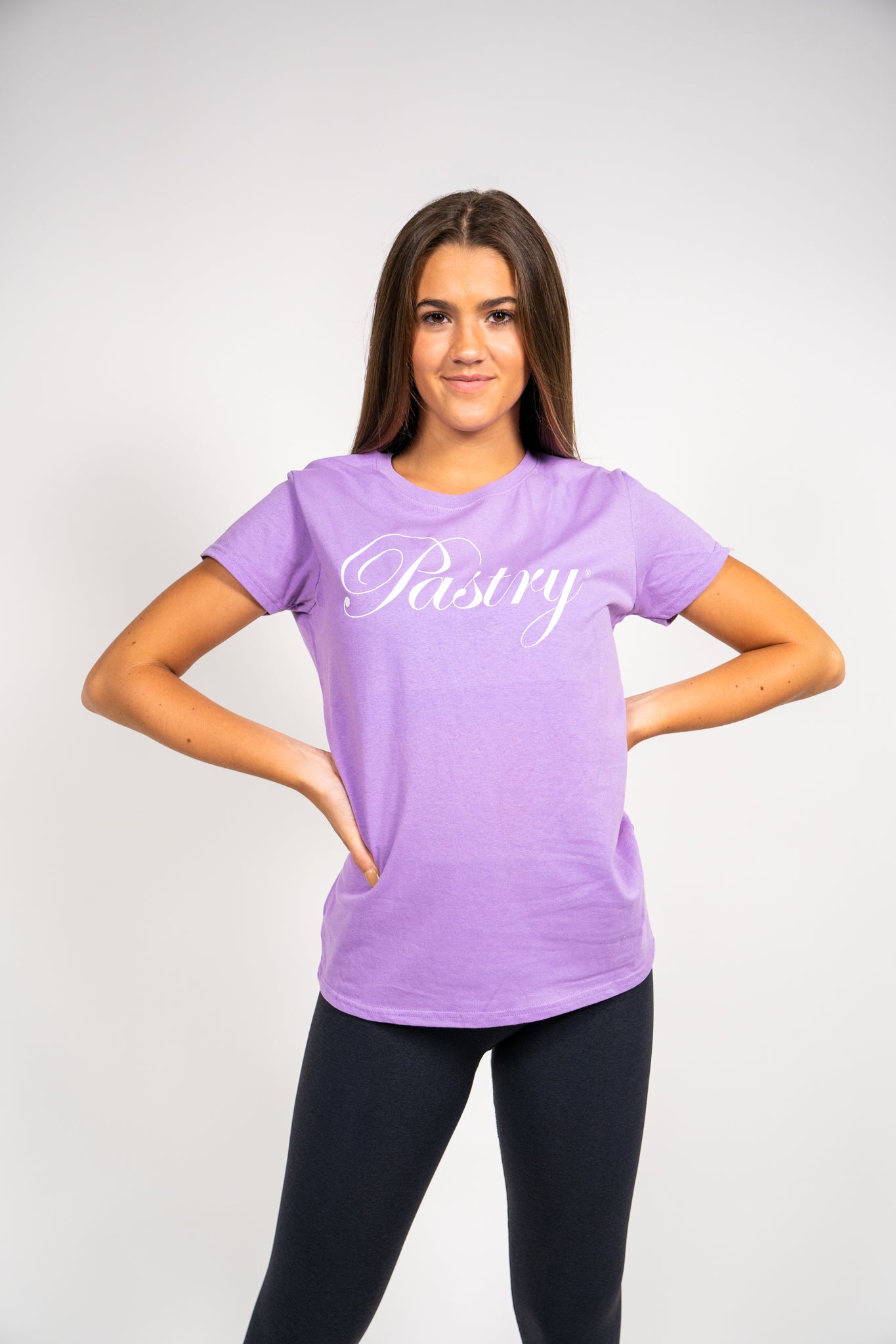 Woman wearing Pastry Tee Shirt Lavender with White Sparkle Logo
