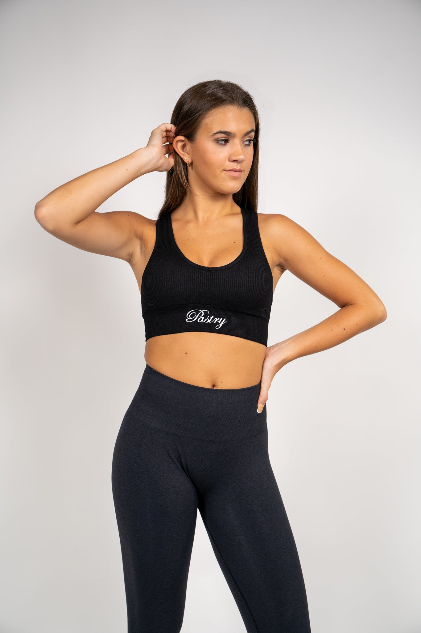 Woman wearing Pastry Ribbed Seamless Sports Bra Black front view