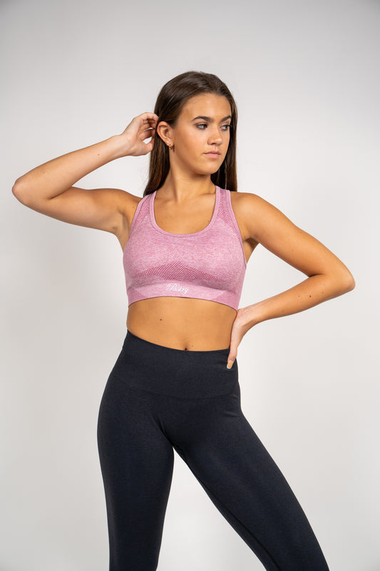 Woman wearing Pastry Seamless Vital Sports Bra Dusty Pink Marl front view