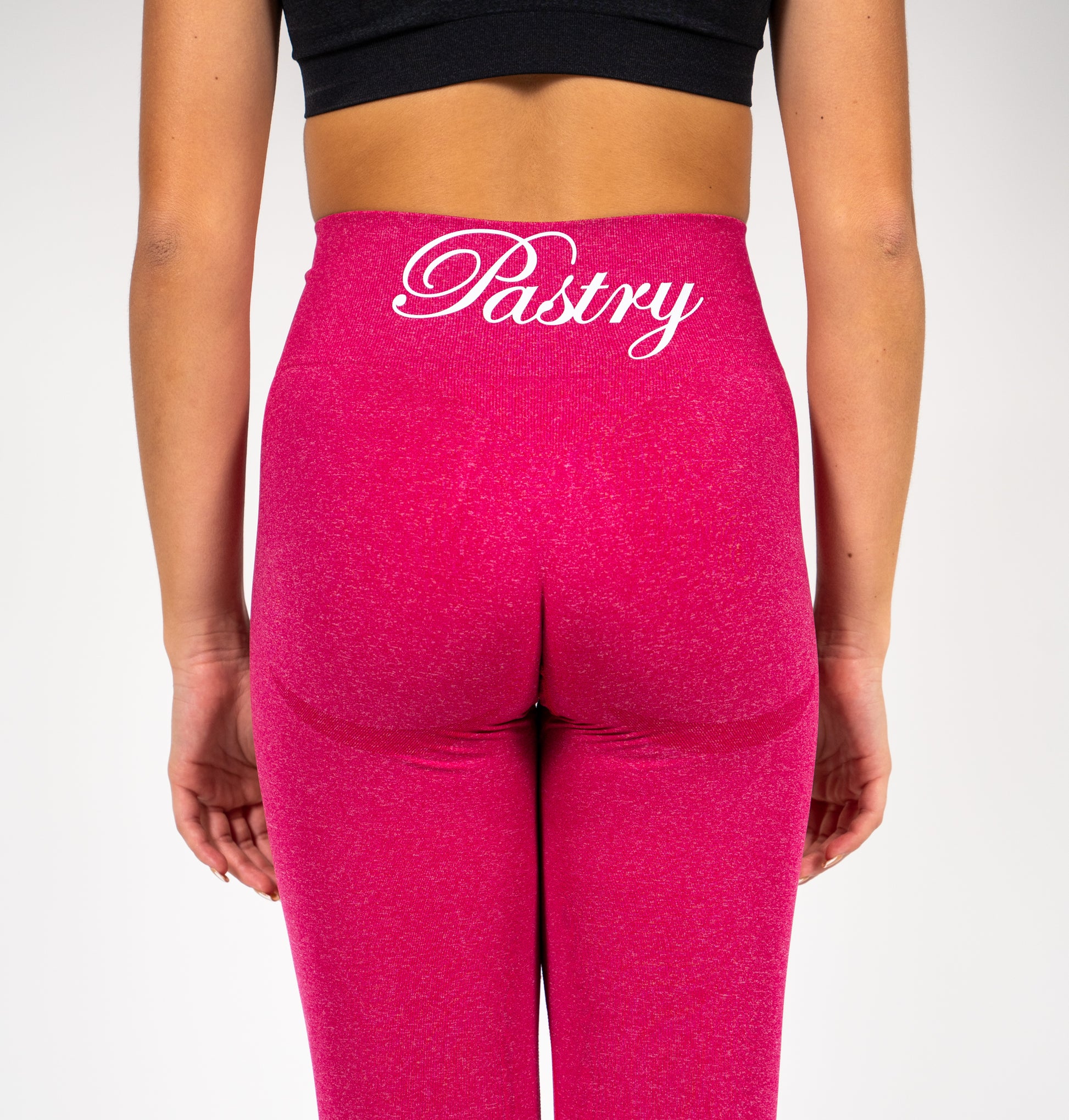 Woman wearing Pastry Seamless Leggings Hot Pink Marl back view