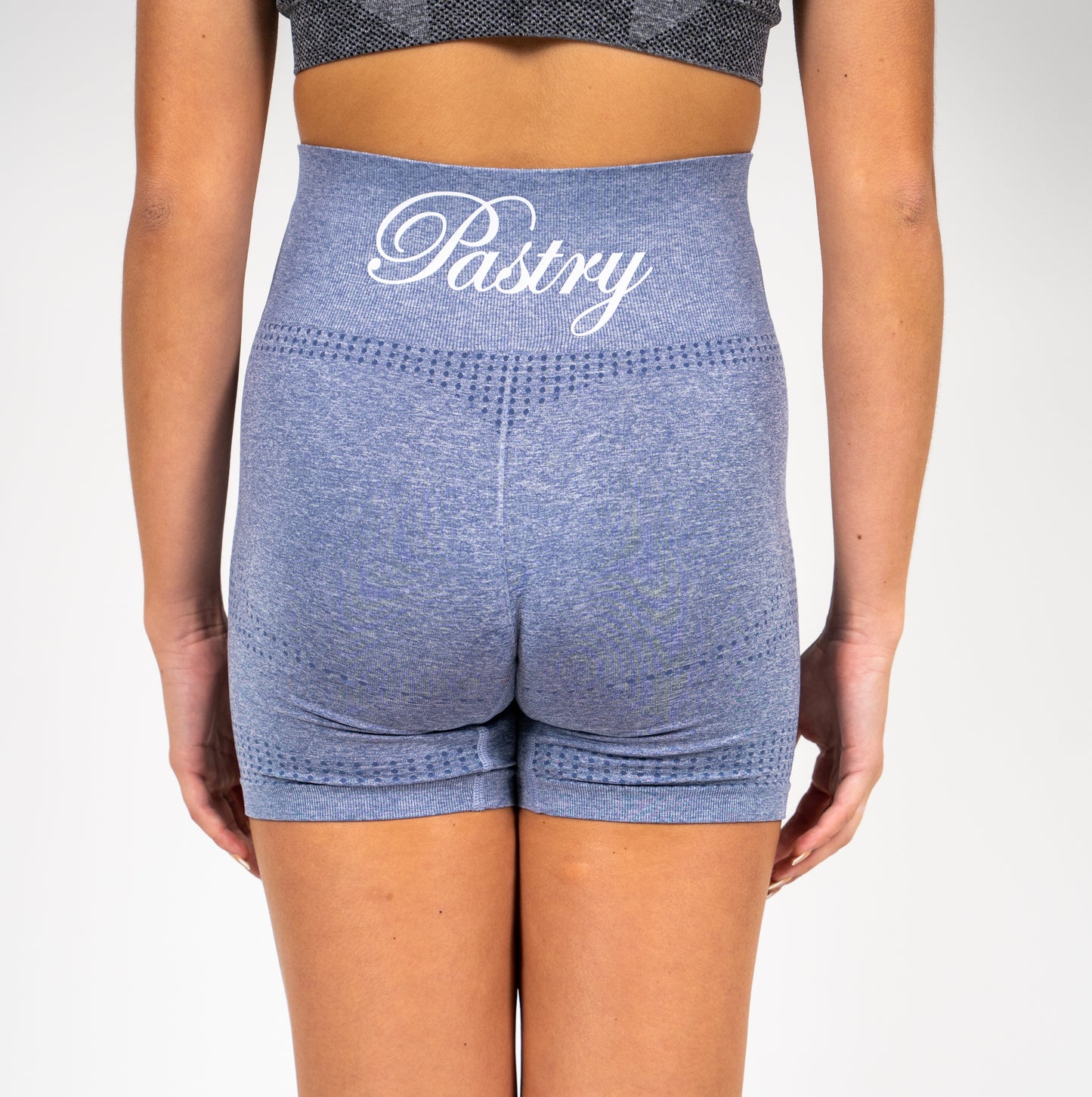 Woman wearing Pastry Seamless High Waisted Shorts Steel Blue Marl back view